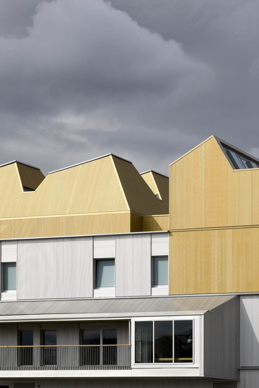 Trapezoidal, golden roof at Scottish Ballet, Glasgow. Malcolm Fraser Architects
