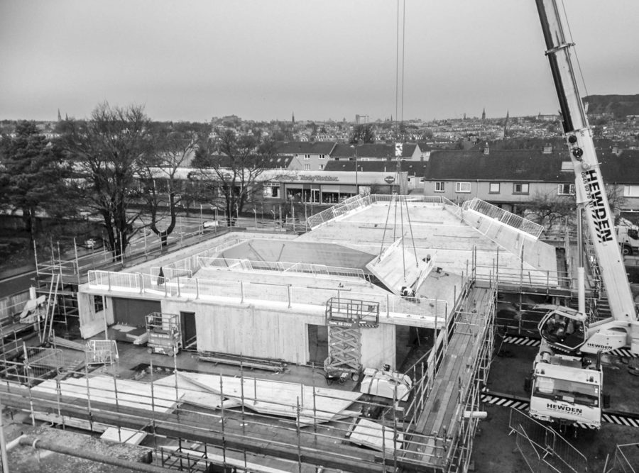 Site view from above as cross-laminated timber is installed at Arcadia Nursery, University of Edinburgh. Malcolm Fraser Architects