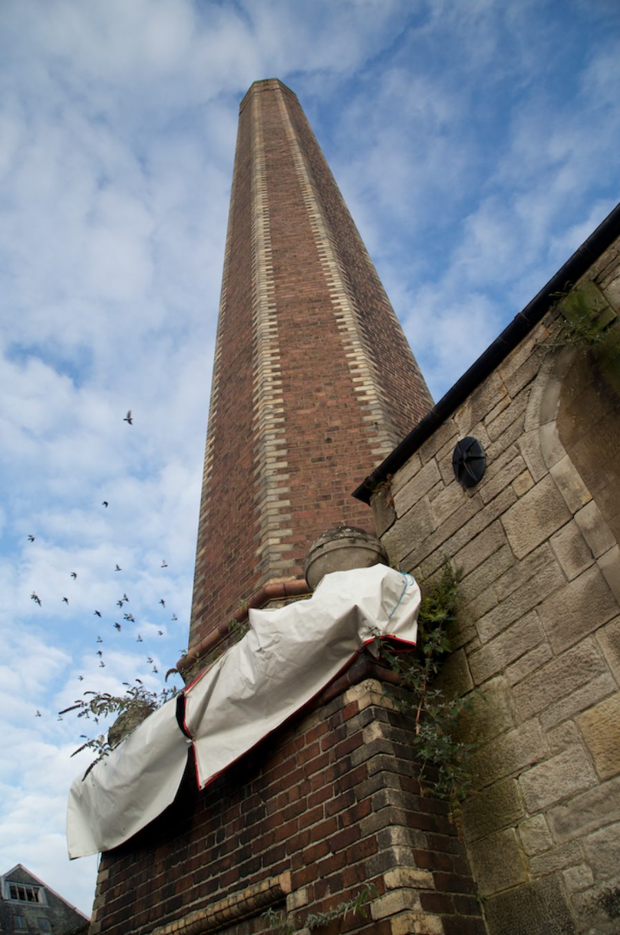 View of chimney stack located on the site of Pilmuir Works, Dunfermline